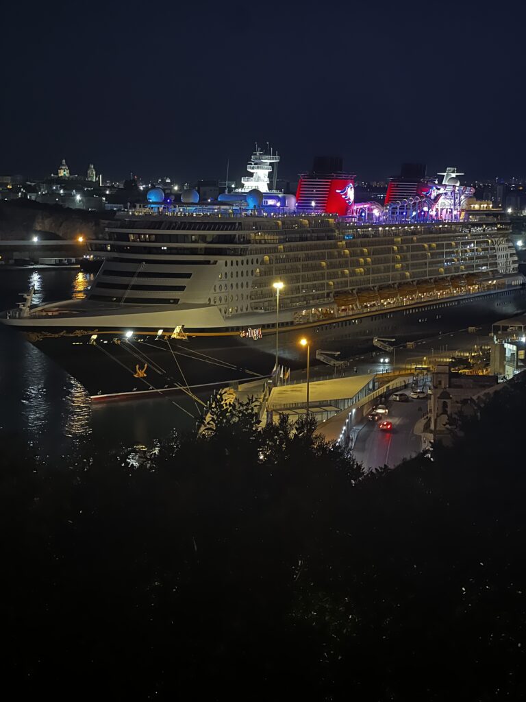 Disney Dream in port in Valetta, Malta.  Disney sits in its own cruise line tier between mainstream and premium lines.