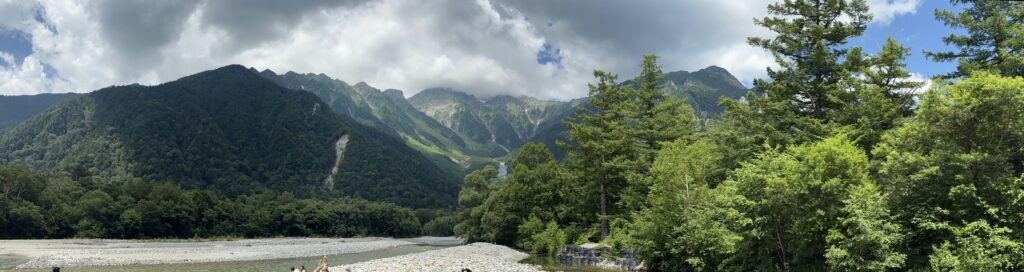 Kamikochi Valley Crystal clear river winding through Kamikochi valley with the Japanese Alps in the background. Our second stop on our post-cruise Japan tour.