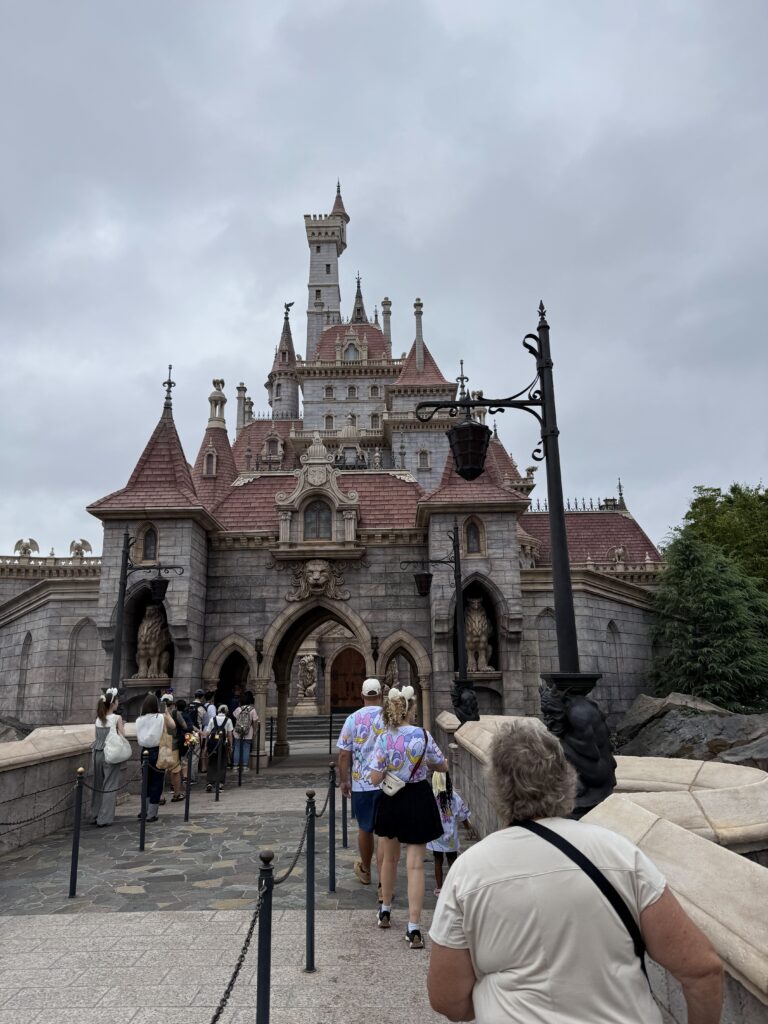 Beast’s Castle at Tokyo Disneyland – Enchanted Tale of Beauty and the Beast Guests (my family) walking toward Beast’s Castle entrance at Tokyo Disneyland’s Enchanted Tale of Beauty and the Beast attraction in Fantasyland.