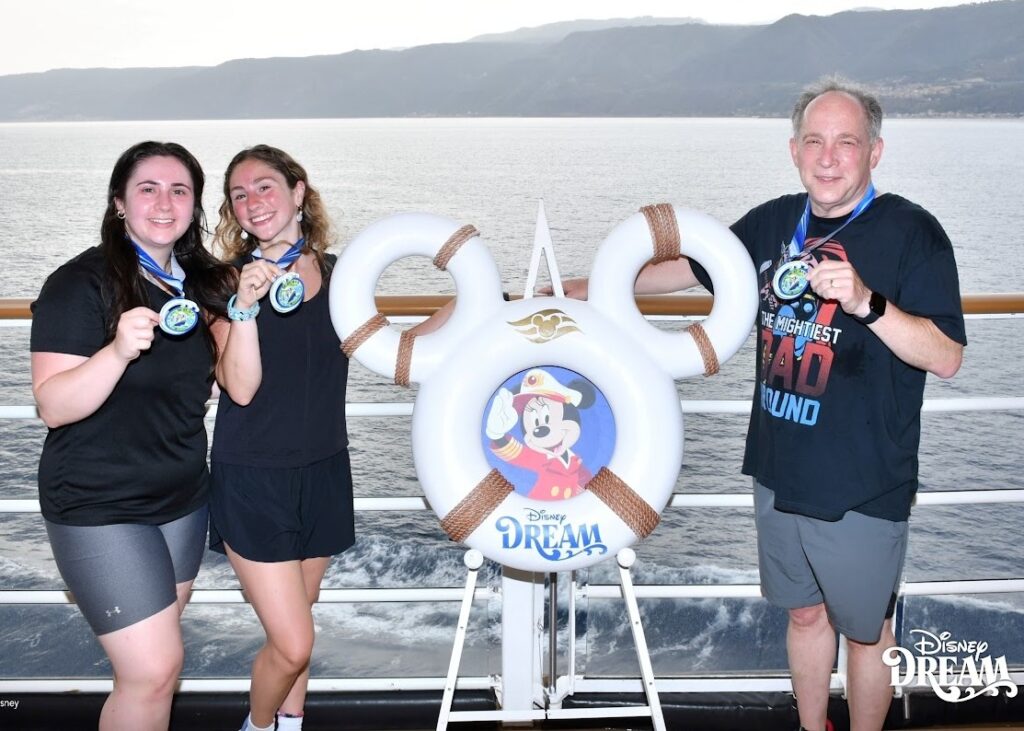 Reinhold Hill and Daughters after completing 5K run on Disney Dream