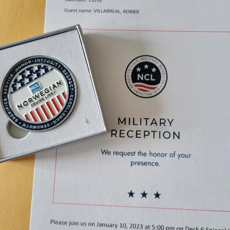 Norwegian Cruise Line military reception invitation with NCL veteran appreciation pin. Part of blog post on Silver Cove Great Stirrup Cay Spa Hack.
