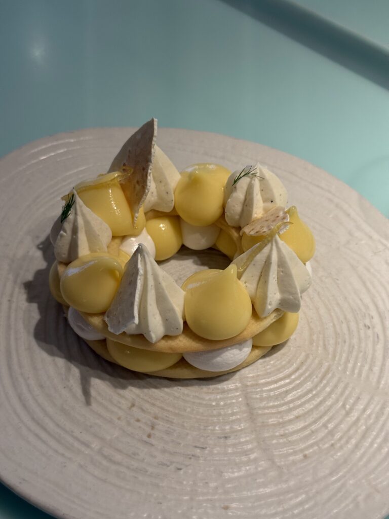 Dessert Display Featuring Lemon Tart With Meringue at Test Kitchen on Virgin Voyages Scarlet Lady During Cruise Experience