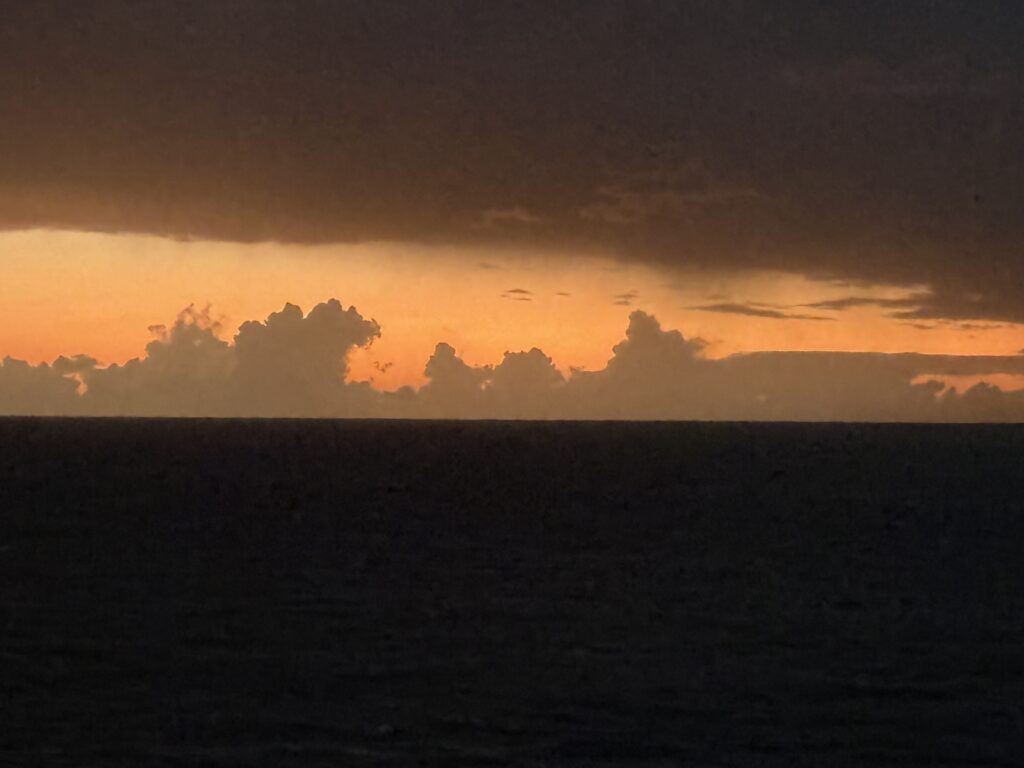Sunset Over the Ocean as the Cruise Embarks From Miami on March 27 Showcasing the Vibrant Hues of the Sky